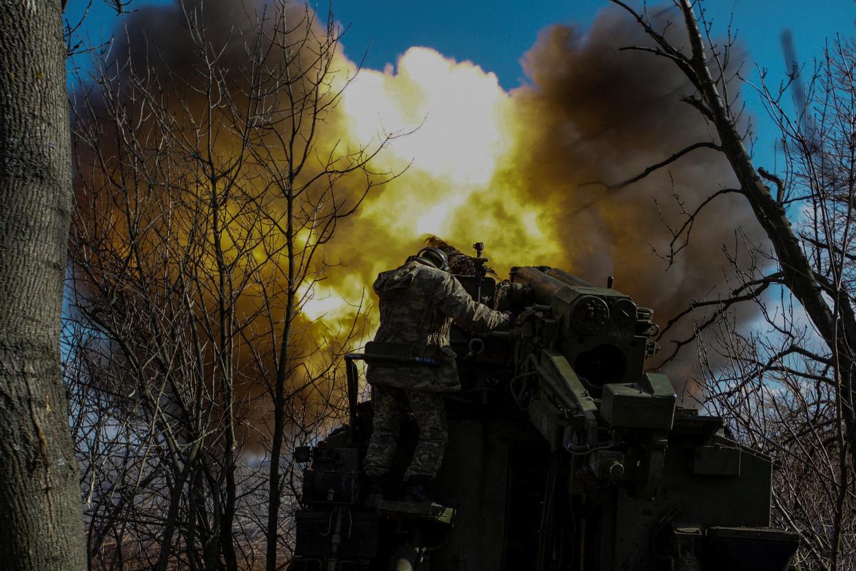 Ukrainian servicemen fire a 2S5 Giatsint-S self-propelled howitzer outside Bakhmut on Sunday (REUTERS/Anna Kudriavtseva)