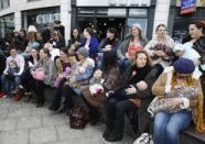 <div class="caption-credit"> Photo by: Facebook</div><b>Topless moms who do:</b> Facebook's ban on breastfeeding pictures didn't start in 2012, but this was the year moms wanted to end it. Since February, breastfeeding advocates have staged nurse-in protests in hopes of changing the network's "indecency" regulations. As it stands, breastfeeding photos are allowed on the site as long as the entire breast is not exposed. But many moms claim their pictures were removed despite following the rules.