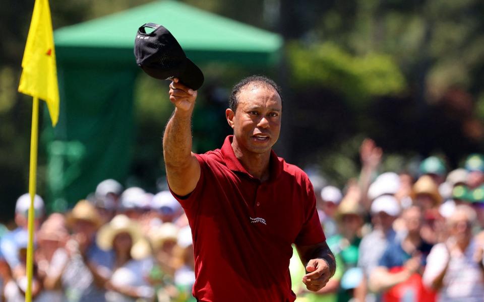 Augusta National Golf Club, Augusta, Georgia, U.S. - April 14, 2024 Tiger Woods of the U.S. acknowledges the crowd on the green on the 18th hole after completing his final round