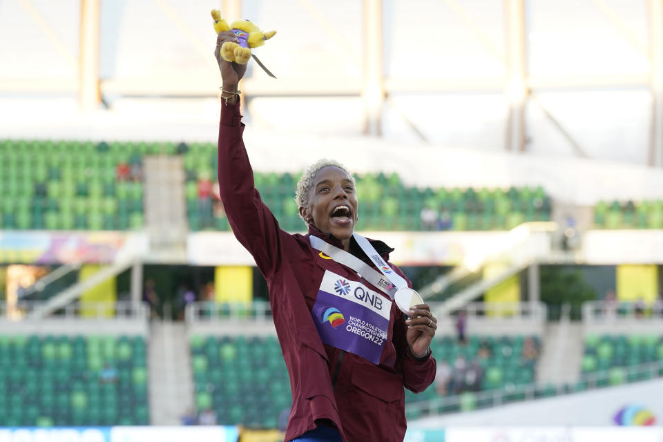 Gold medalist Yulimar Rojas, of Venezuela, celebrates during a medal ceremony for triple jump women at the World Athletics Championships on Monday, July 18, 2022, in Eugene, Ore. (AP Photo/Gregory Bull)