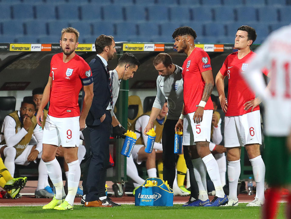 SOFIA, BULGARIA - OCTOBER 14: Tyrone Mings of England speaks with Gareth Southgate, Manager of England during the UEFA Euro 2020 qualifier between Bulgaria and England on October 14, 2019 in Sofia, Bulgaria. (Photo by Catherine Ivill/Getty Images)