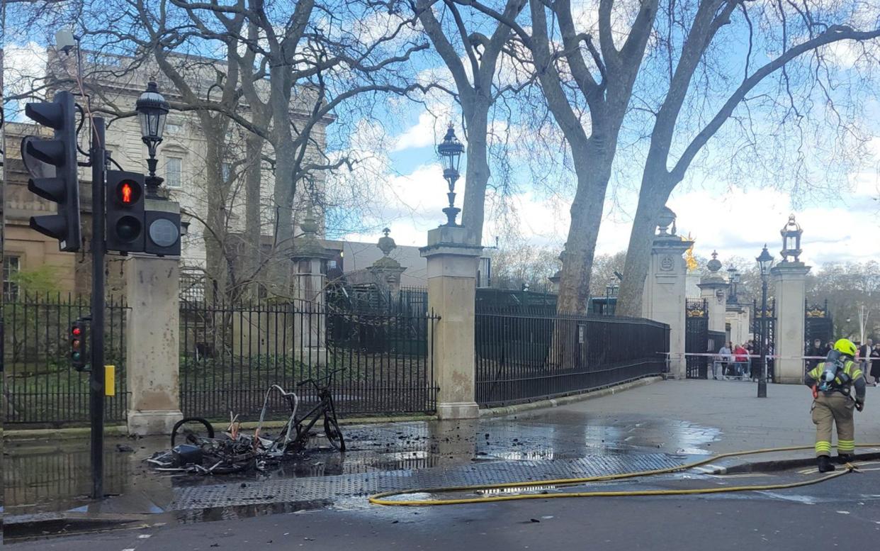 The smouldering remains of what appears to be an e-bike or a rickshaw