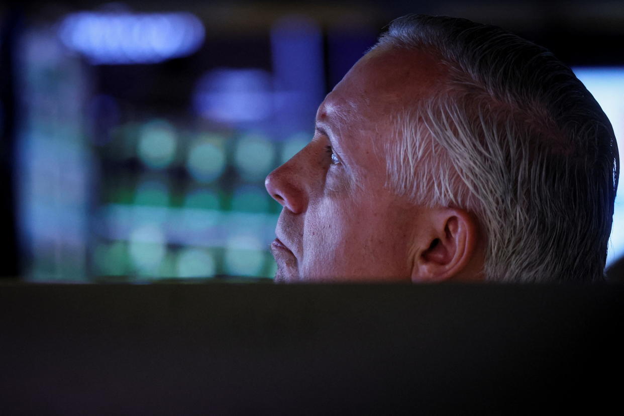 A specialist trader works inside a booth on the floor of the New York Stock Exchange (NYSE) in New York City, U.S., June 3, 2022.  REUTERS/Brendan McDermid