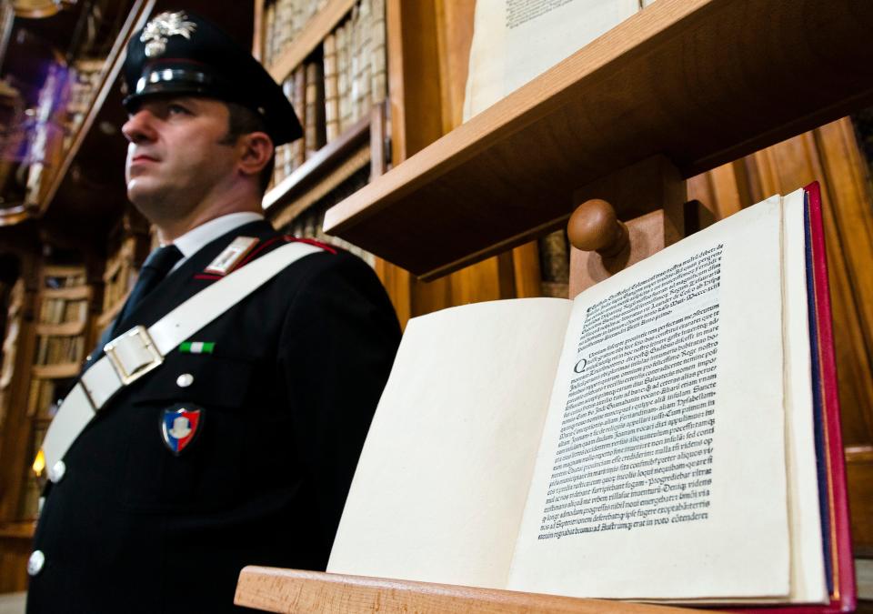 A reprinted copy of Christopher Columbus original letter written in 1493 about the discovery of the New World is displayed during a press conference in Rome, Wednesday, May 18, 2016. The United States has returned to Italy a letter written by Christopher Columbus in 1493 about his discovery of the New World that was stolen from a Florence library and unwittingly acquired by the Library of Congress.
