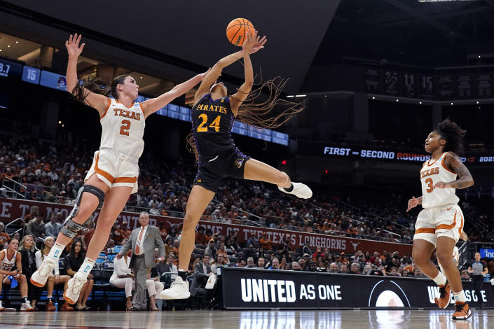 East Carolina guard Kimora Jenkins (24) is blocked by Texas guard Shaylee Gonzales (2) as she drives t the basket during the first half of a first-round college basketball game in the NCAA Tournament in Austin, Texas, Saturday, March 18, 2023. (AP Photo/Eric Gay)