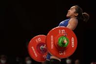 Hidilyn Diaz of Philippines competes in the women's 55kg weightlifting event, at the 2020 Summer Olympics, Monday, July 26, 2021, in Tokyo, Japan. (AP Photo/Luca Bruno)