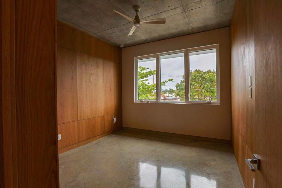 The house has three bedrooms, including the one pictured above with removable Purebond plywood panels. Each bedroom comes with its own closet and full bathroom.