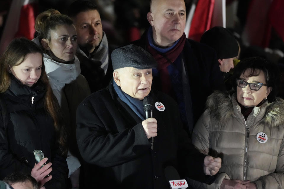 Jaroslaw Kaczynski, center, leader of right-wing Law and Justice party that lost power in the October parliamentary elections protest the moves by the new pro-European Union government which has taken control of state media, in front of the parliament building in Warsaw, Poland, on Thursday, Jan 11, 2024. Law and Justice, frustrated over the loss of power is seeking to undermine the actions of the new government of Prime Minister Donald Tusk. (AP Photo/Czarek Sokolowski)