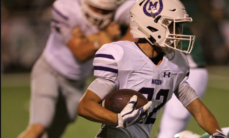 Mason High School's Blake Lewis picks up yardage against Wall during a nondistrict football game at Hawk Stadium on Friday, Sept. 18, 2020.