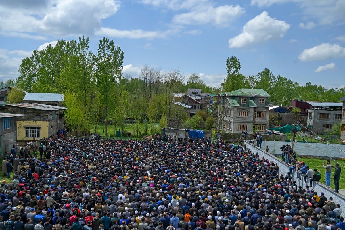 People carry coffins of victims who died after a boat overturned in the Jhelum river in Srinagar  (AFP via Getty Images)