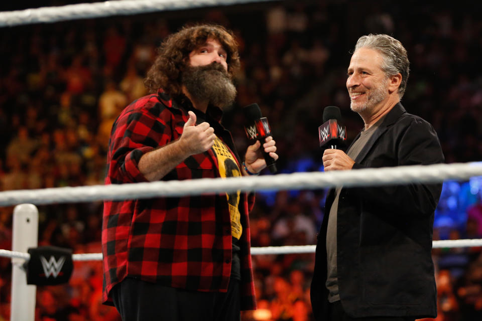 Former 'Daily Show' host Jon Stewart has made multiple WWE appearances. He <a href="https://www.youtube.com/watch?v=Dn-iHzOZk2M" rel="nofollow noopener" target="_blank" data-ylk="slk:first guested on 'Raw';elm:context_link;itc:0;sec:content-canvas" class="link ">first guested on 'Raw'</a> on March 2, 2015. Stewart went on to host Summerslam 2015 main event and pummeled John Cena with a chair, costing him the U.S. Championship. The following episode of 'Raw,' <a href="https://www.youtube.com/watch?v=XxZCRmfV5fw" rel="nofollow noopener" target="_blank" data-ylk="slk:Stewart appeared in the ring with Rick Flair and John Cena;elm:context_link;itc:0;sec:content-canvas" class="link ">Stewart appeared in the ring with Rick Flair and John Cena</a> only to get an Attitude Adjustment. Stewart reappeared at Summerslam 2016 to <a href="https://www.youtube.com/watch?v=yo20QIdhW28" rel="nofollow noopener" target="_blank" data-ylk="slk:pledge his allegiance to the New Day;elm:context_link;itc:0;sec:content-canvas" class="link ">pledge his allegiance to the New Day</a>. And in 2018, <a href="https://www.youtube.com/watch?v=AND6ViXskYc" rel="nofollow noopener" target="_blank" data-ylk="slk:Stewart and his son filmed a backstage interview;elm:context_link;itc:0;sec:content-canvas" class="link ">Stewart and his son filmed a backstage interview</a> at Summerslam.