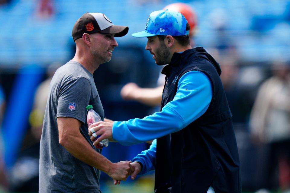 Panthers quarterback Baker Mayfield talks with Browns wide receivers coach Chad O'Shea before a game Sunday, Sept. 11, 2022, in Charlotte, NC