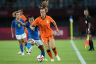 Netherlands' Jill Roord controls the ball against Brazil's Debinha during a women's soccer match at the 2020 Summer Olympics, Saturday, July 24, 2021, in Miyagi, Japan. (AP Photo/Andre Penner)