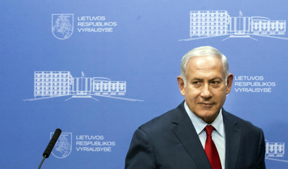 Israel's Prime Minister Benjamin Netanyahu listens during a news conference following his meeting with Lithuania's Prime Minister Saulius Skvernelis at the government's headquarters in Vilnius, Lithuania, Thursday, Aug. 23, 2018. Netanyahu arrived in Lithuania Thursday for a four-day visit during which he will also meet his Latvian and Estonian counterparts, local officials and the Jewish community. (AP Photo/Mindaugas Kulbis)