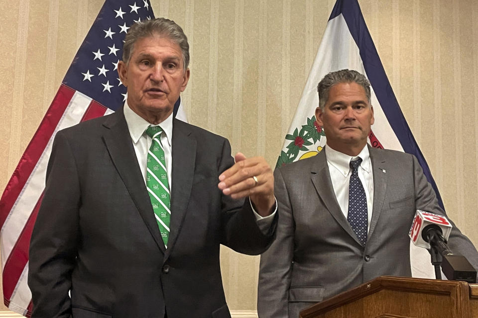 U.S. Sen. Joe Manchin, a West Virginia Democrat, and Competitive Power Ventures CEO Gary Lambert, right, speak at a news conference Friday, Sept. 16, 2022, in Charleston, West Virginia. CPV plans to build a natural gas power plant designed to capture climate-changing carbon in West Virginia. (AP Photo/John Raby)