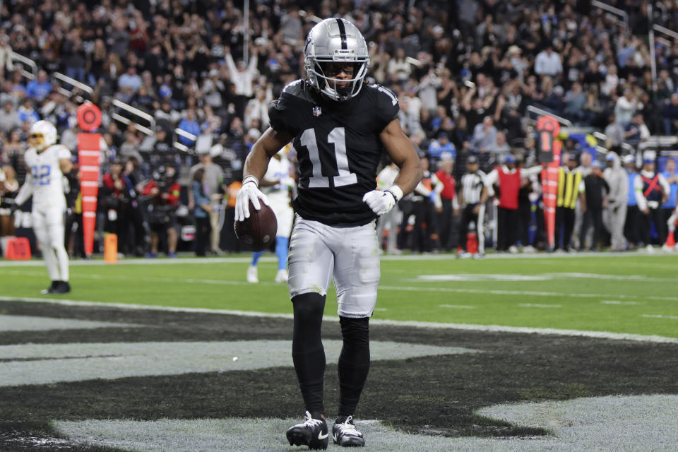 Las Vegas Raiders wide receiver Tre Tucker (11) celebrates after scoring a touchdown against the Los Angeles Chargers during the first half of an NFL football game, Thursday, Dec. 14, 2023, in Las Vegas. (AP Photo/Steve Marcus)