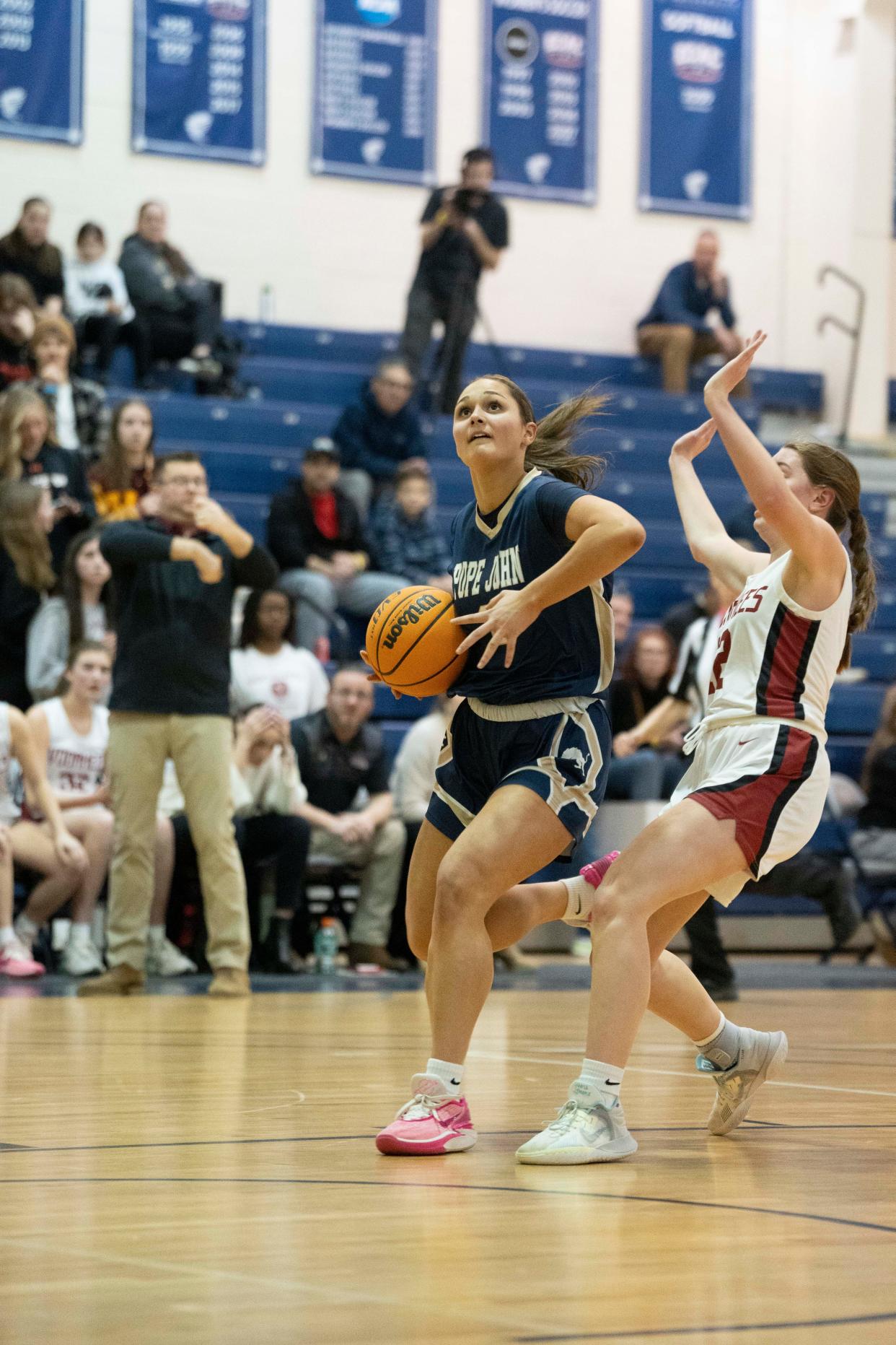 Feb 16, 2024; Hackettstown, NJ, USA; Pope John vs. Voorhees in the Hunterdon/Warren/Sussex Girls Basketball Tournament final at Centenary University gym. PJ #2 Kaitlyn Platt drives to the basket as V #12 Alex McComb defends .