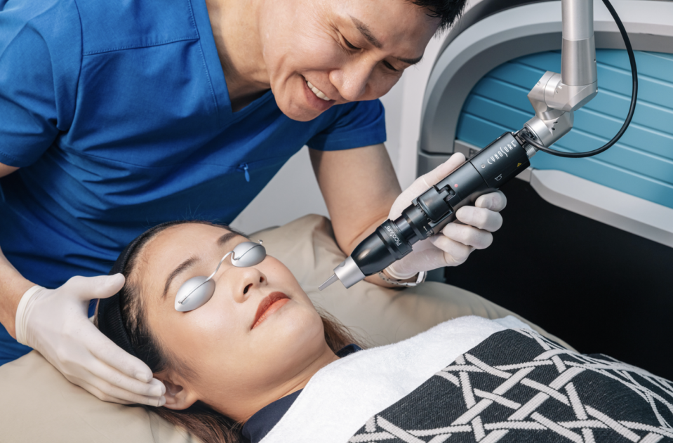 Dr Thean uses top-of-the-line machinery on a young lady with googles on her eyes.