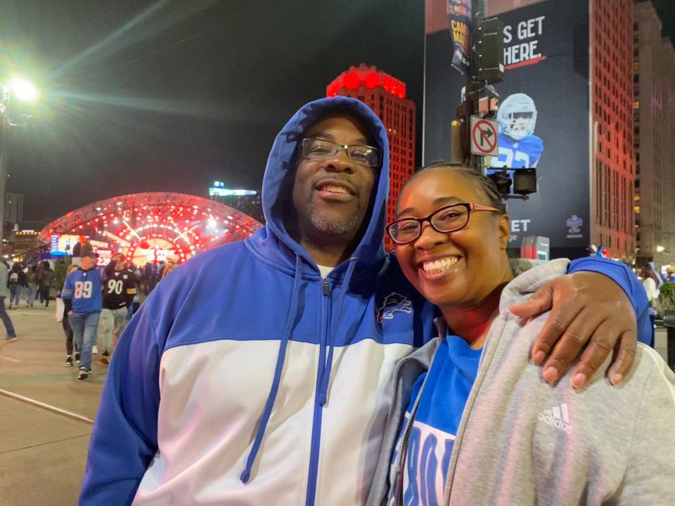 Andre Lo, 46, and Rosalind Hawkes, both of Detroit, prepare to head out Friday night after seeing the Lions make their second pick of the NFL draft.