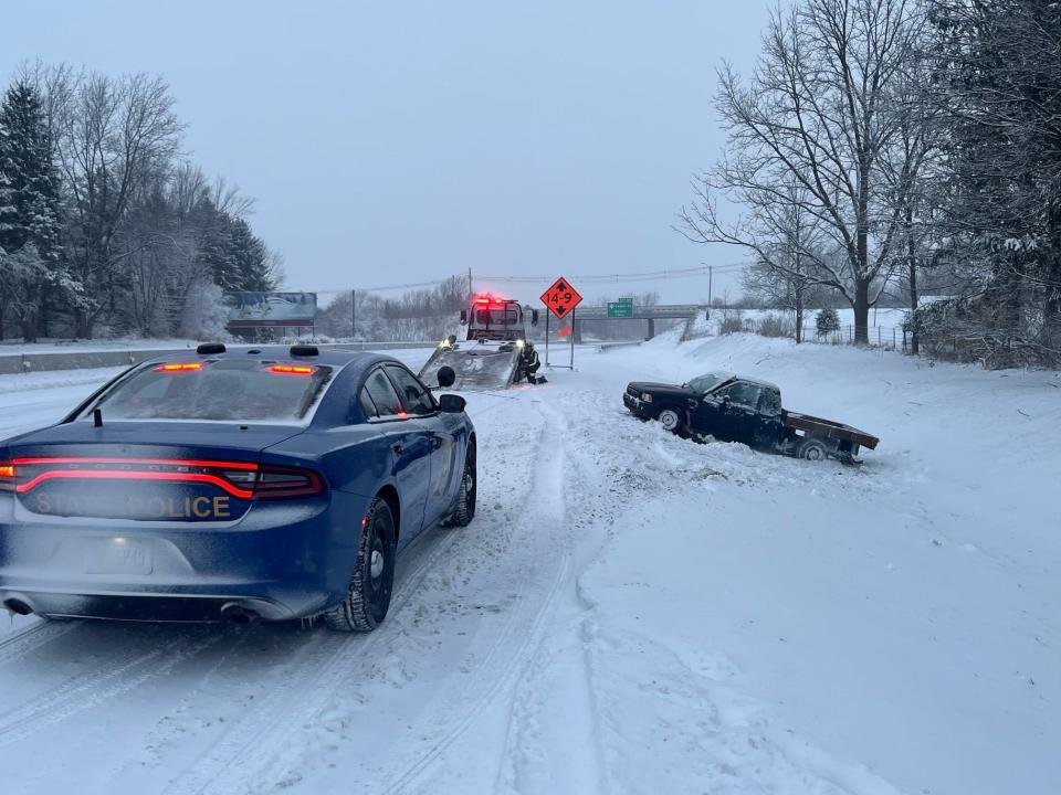 Michigan State Police said this tow truck was struck by a vehicle while attempting to pull another vehicle from a ditch on US-127 Friday morning. No one was injured.