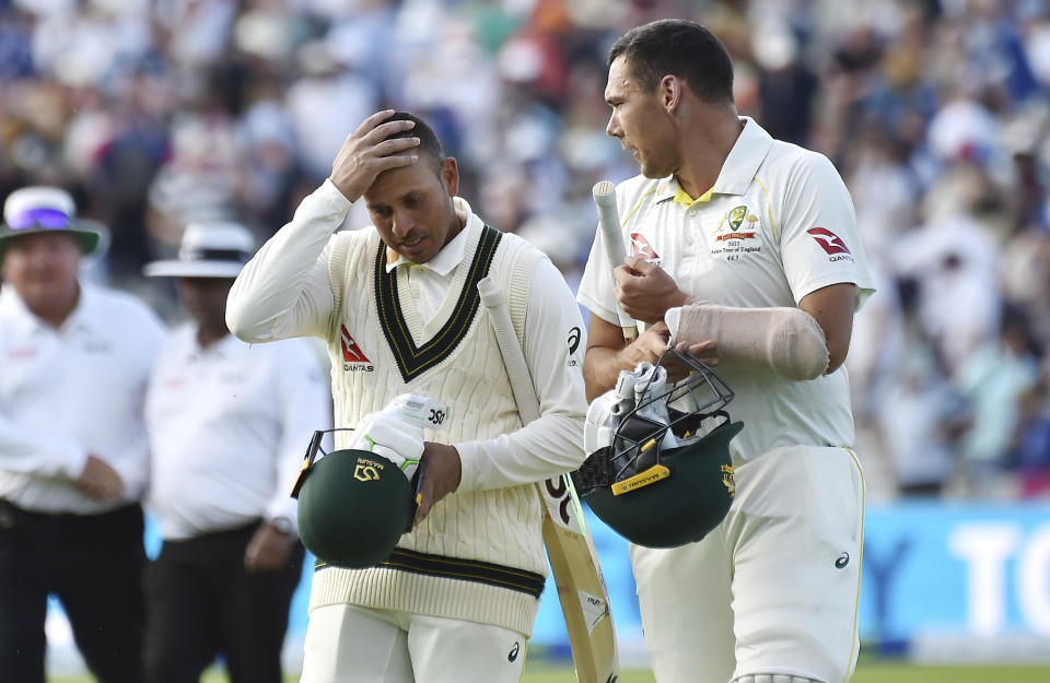 Australia's Usman Khawaja, left, and Australia's Scott Boland leave the pitch at the end of play during day four of the first Ashes Test cricket match, at Edgbaston, Birmingham, England, Monday, June 19, 2023. (AP Photo/Rui Vieira)