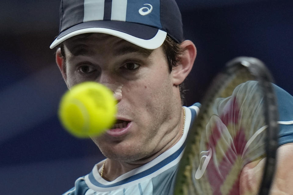 Nicolas Jarry of Chile returns a shot to Grigor Dimitrov of Bulgaria during the men's singles quarterfinal match in the Shanghai Masters tennis tournament at Qizhong Forest Sports City Tennis Center in Shanghai, China, Friday, Oct. 13, 2023. (AP Photo/Andy Wong)