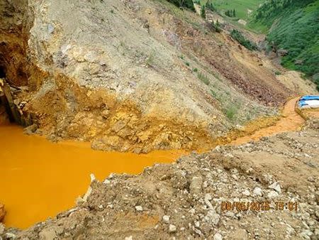 FILE PHOTO - Yellow mine waste water is seen at the entrance to the Gold King Mine in San Juan County, Colorado, U.S. in this picture released by the Environmental Protection Agency (EPA) taken on August 5, 2015. EPA/Handout via REUTERS