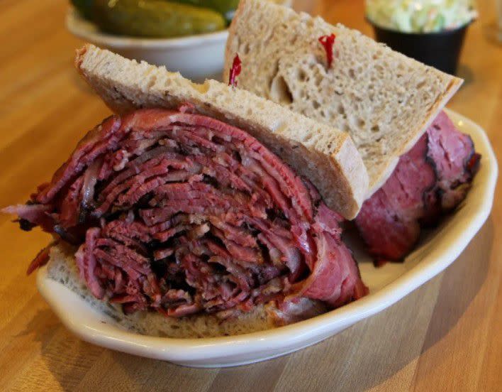 <p>Grab a wad of napkins and bite into two of the most iconic Jewish deli sandwiches ever: pastrami sandwiches, and corned beef sandwiches.</p><p><br></p><h3 class="wp-block-heading">Kenny & Ziggy’s Delicatessen Pastrami Sandwich Kit</h3><p>Houston’s <a href="https://www.goldbelly.com/kenny-and-ziggys-deli?utm_source=blog&utm_medium=pastrami+vs+corned+beef&utm_campaign=kenny+ziggys" rel="nofollow noopener" target="_blank" data-ylk="slk:Kenny & Ziggy’s Delicatessen;elm:context_link;itc:0;sec:content-canvas" class="link rapid-noclick-resp">Kenny & Ziggy’s Delicatessen</a> is an authentic New York delicatessen opened by Ziggy Gruber. The deli’s team expertly house-cures its brisket into deliciously tender “regular” corned beef and “first cut” corned beef. They also perfectly smoke and flavor their “regular” pastrami and “first cut” pastrami and pastrami sandwich kits.</p><span class="copyright"> Kenny & Ziggy’s Delicatessen </span>