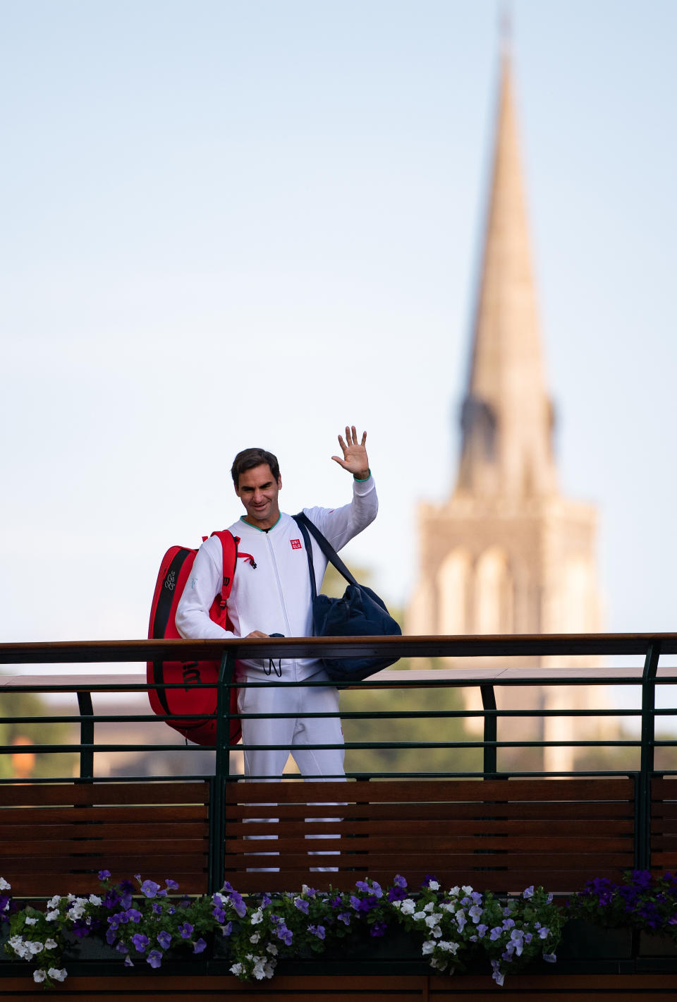 Roger Federer (pictured) waves to fans at Wimbledon.