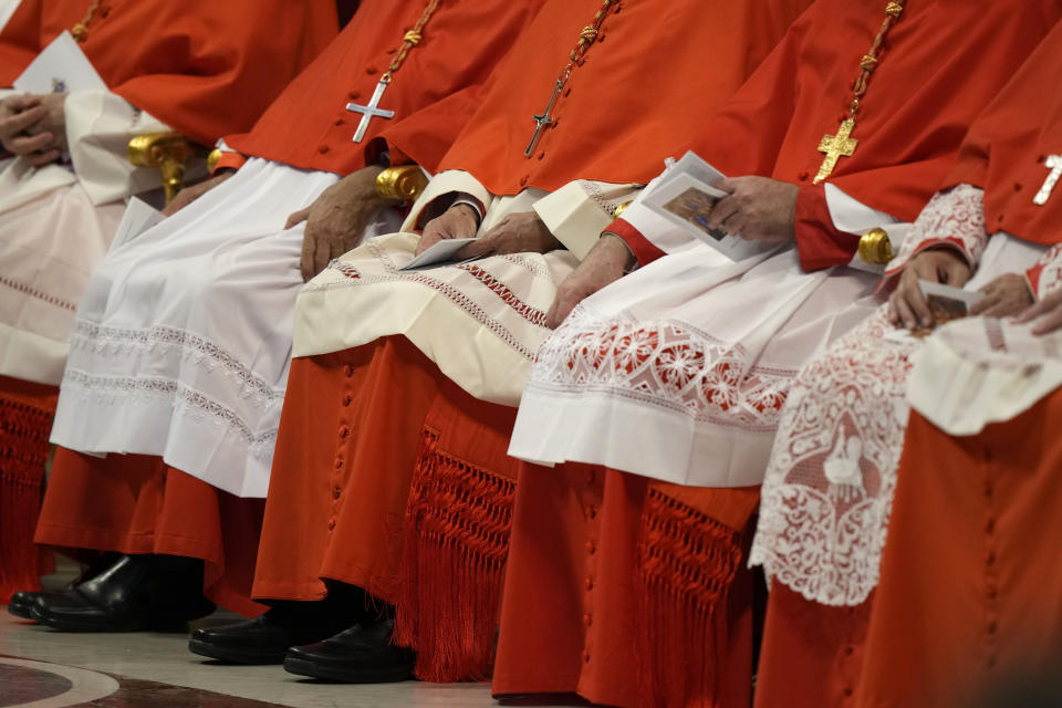 FILE - New Cardinals sit during consistory inside St. Peter's Basilica, at the Vatican, Saturday, Aug. 27, 2022. Pope Francis has announced he has chosen 21 new cardinals, including prelates from Jerusalem and Hong Kong, places where Catholics are a small minority. The pope announced his picks during his customary appearance on Sunday, July 9, 2023 to the public in St. Peter’s Square, saying the ceremony to formally install the churchmen as cardinals will be held on Sept. 30. (AP Photo/Andrew Medichini, File)