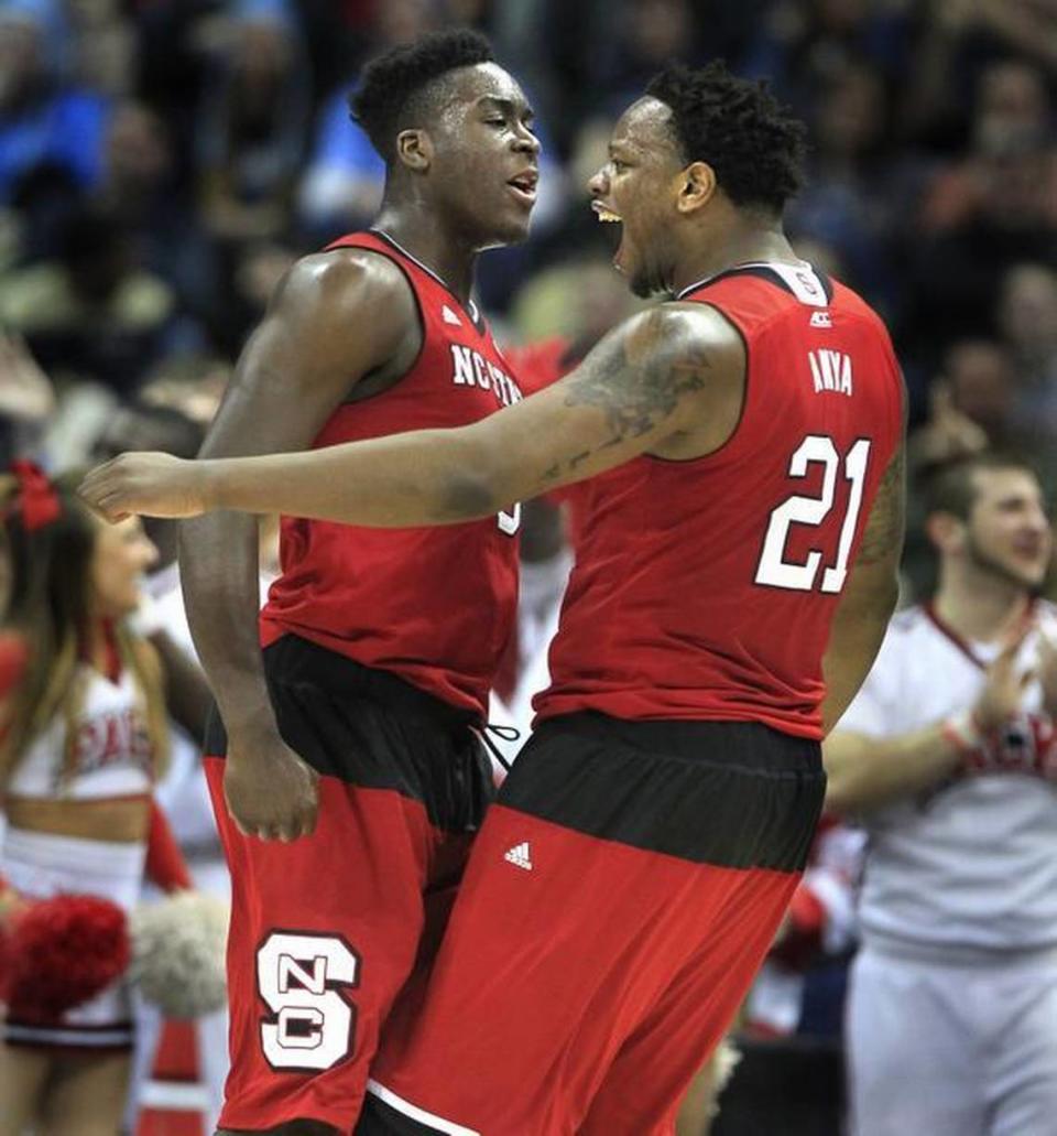 N.C. State’s BeeJay Anya (21), right, celebrates with Abdul-Malik Abu (0) after Anya blocked a shot during the first half of the Wolfpack’s game against Villanova in the third round NCAA Division I Men’s Basketball Tournament at the Consol Energy Center in Pittsburgh, Pa. Saturday, March 21, 2015.