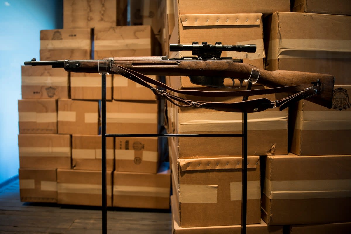 A Carcano Model 91/38 rifle is seen near where Oswald ditched his 50 years earlier, at the Sixth Floor Museum, formerly the site of the Texas School Book Depository (AFP via Getty Images)