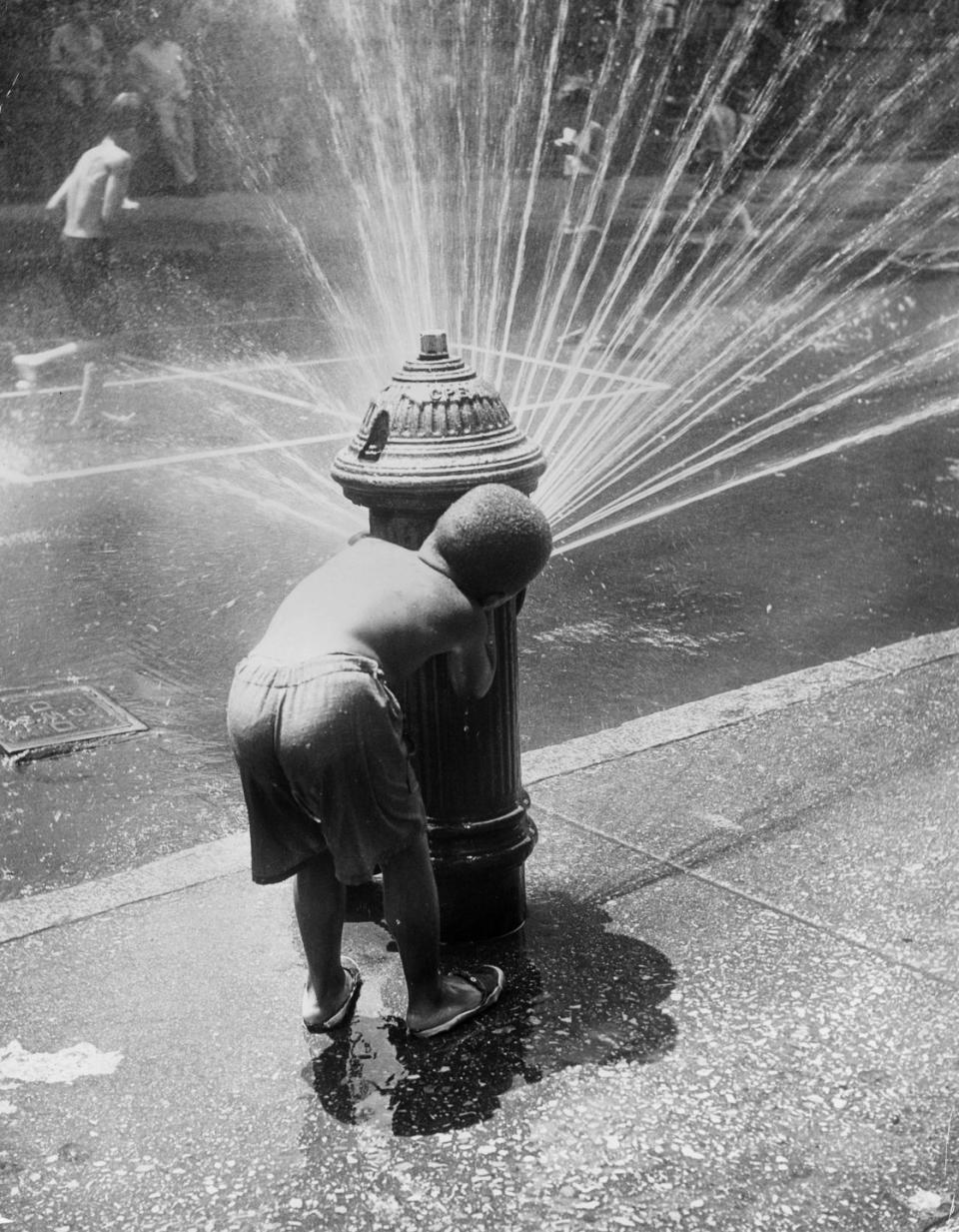 Child sets off a fire hydrant: circa 1945