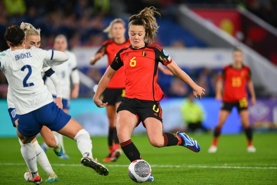 Belgian Tina De Caigny moves forward in England's defence.