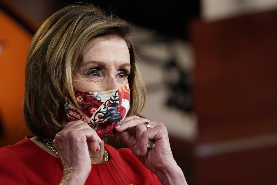 House Speaker Nancy Pelosi of Calif., puts her mask back on after a news conference on Capitol Hill in Washington, Thursday, May 13, 2021. (AP Photo/Susan Walsh)