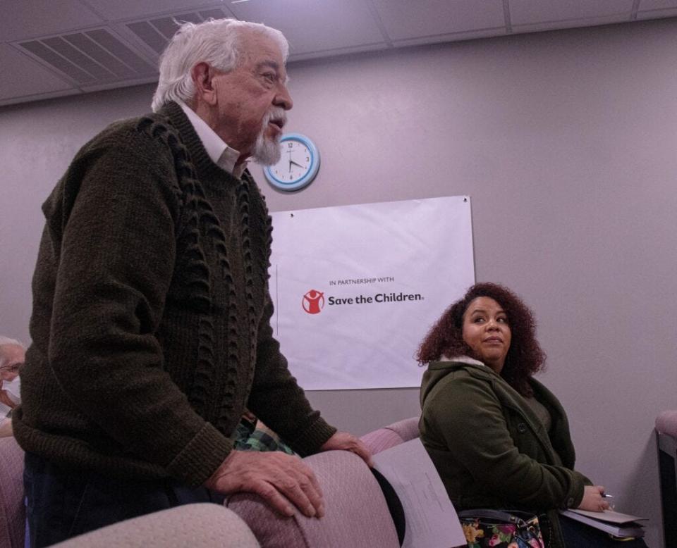 Vanessa Porter listens to former Rep. Antonio Lujan address lawmakers.