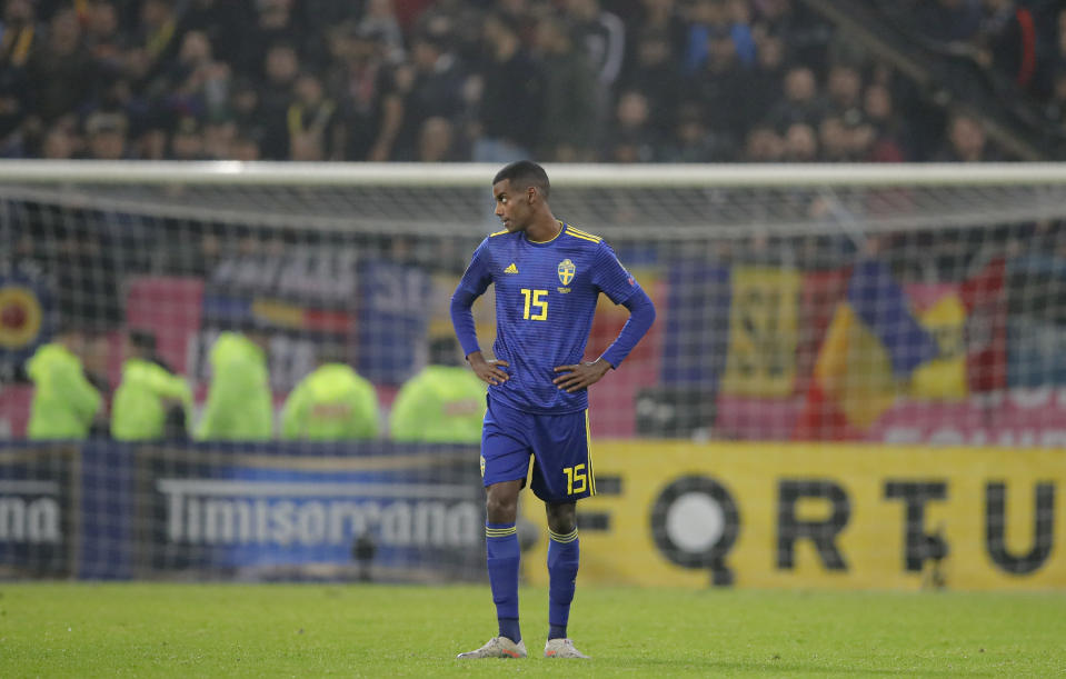 FILE - Sweden's Alexander Isak stands on the pitch as the game was briefly halted by referee Daniele Orsato following alleged racist chants against the players during the Euro 2020 group F qualifying soccer match between Romania and Sweden on the National Arena stadium in Bucharest, Romania, Friday, Nov. 15, 2019. (AP Photo/Vadim Ghirda, File)