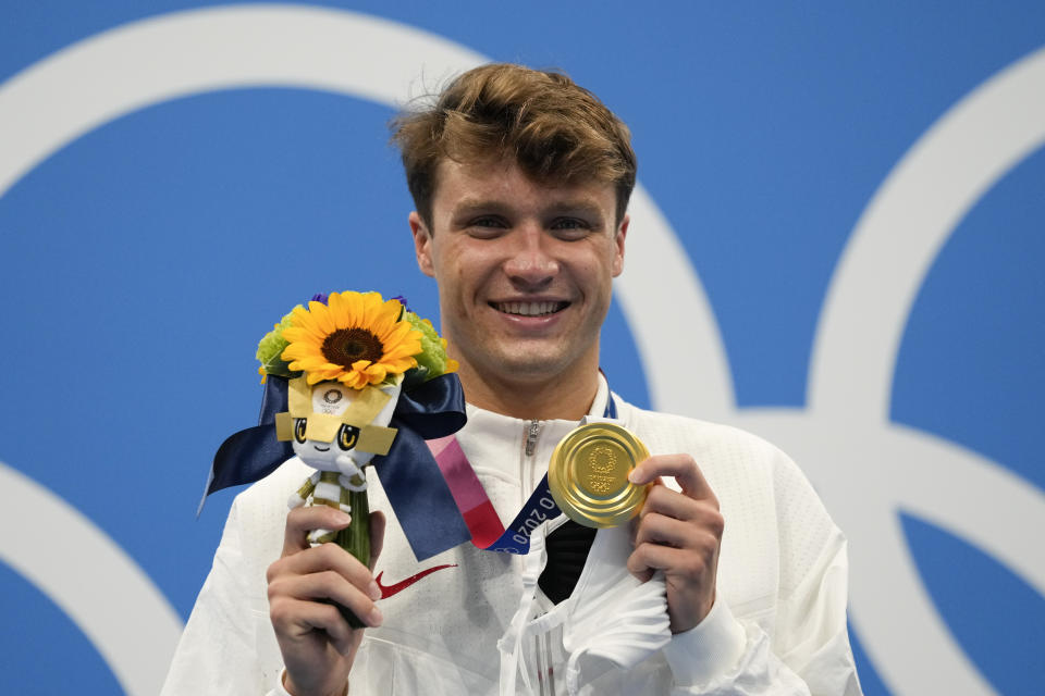 Robert Finke, of United States, poses after winning the gold medal in the men's 1500-meter freestyle final at the 2020 Summer Olympics, Sunday, Aug. 1, 2021, in Tokyo, Japan. (AP Photo/Gregory Bull)