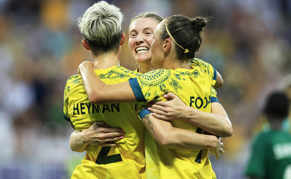 Michelle Heyman, pictured here celebrating with Matildas teammates at the Olympics.