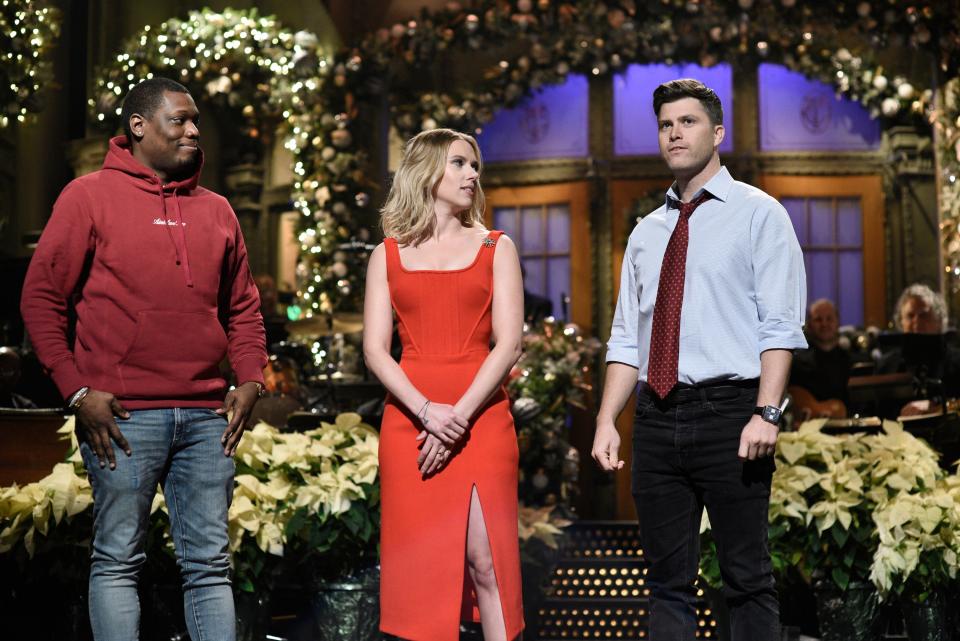 Scarlett Johansson hosts "Saturday Night Live" on Dec. 14, 2019, performing a monologue that includes Michael Che, and her fiancé Colin Jost.