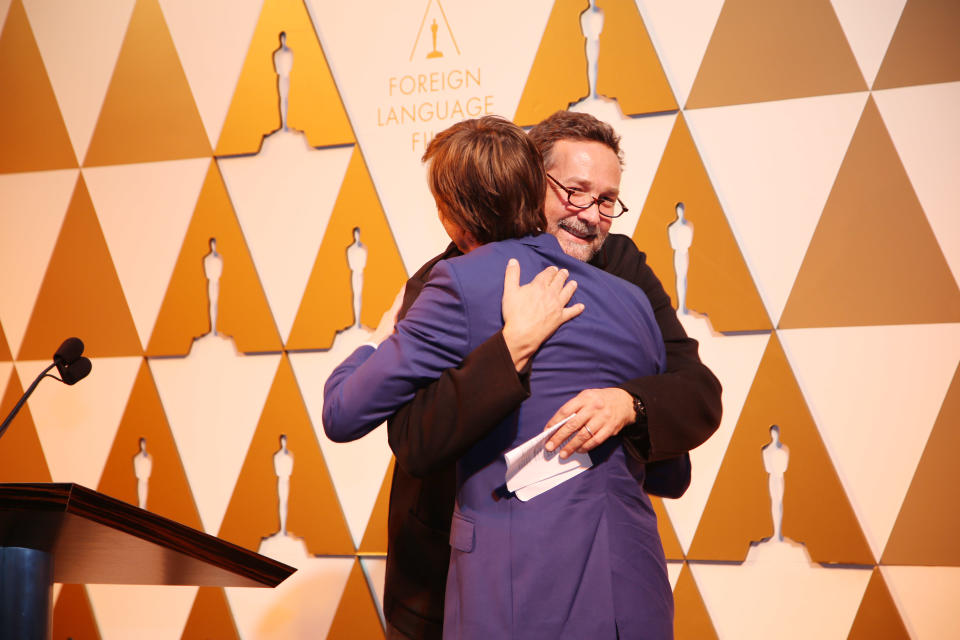 Film director Phedon Papamichael gives a hug to Felix van Groeningen, a Flemish film director of Oscar-nominated foreign language film "The Broken Circle Breakdown," at 86th Academy Awards - Foreign Language Film Award Reception, on Thursday, Feb. 28, 2014 in Los Angeles, Calif. (Photo by Annie I. Bang /Invision/AP)