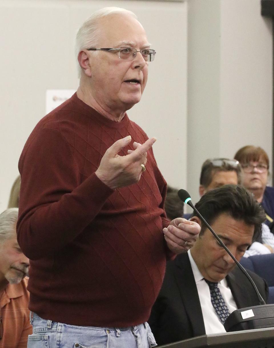 Resident Gary Sniadak speaks on the Miller's Landing subdivision at Thursday's Stow City Council meeting.