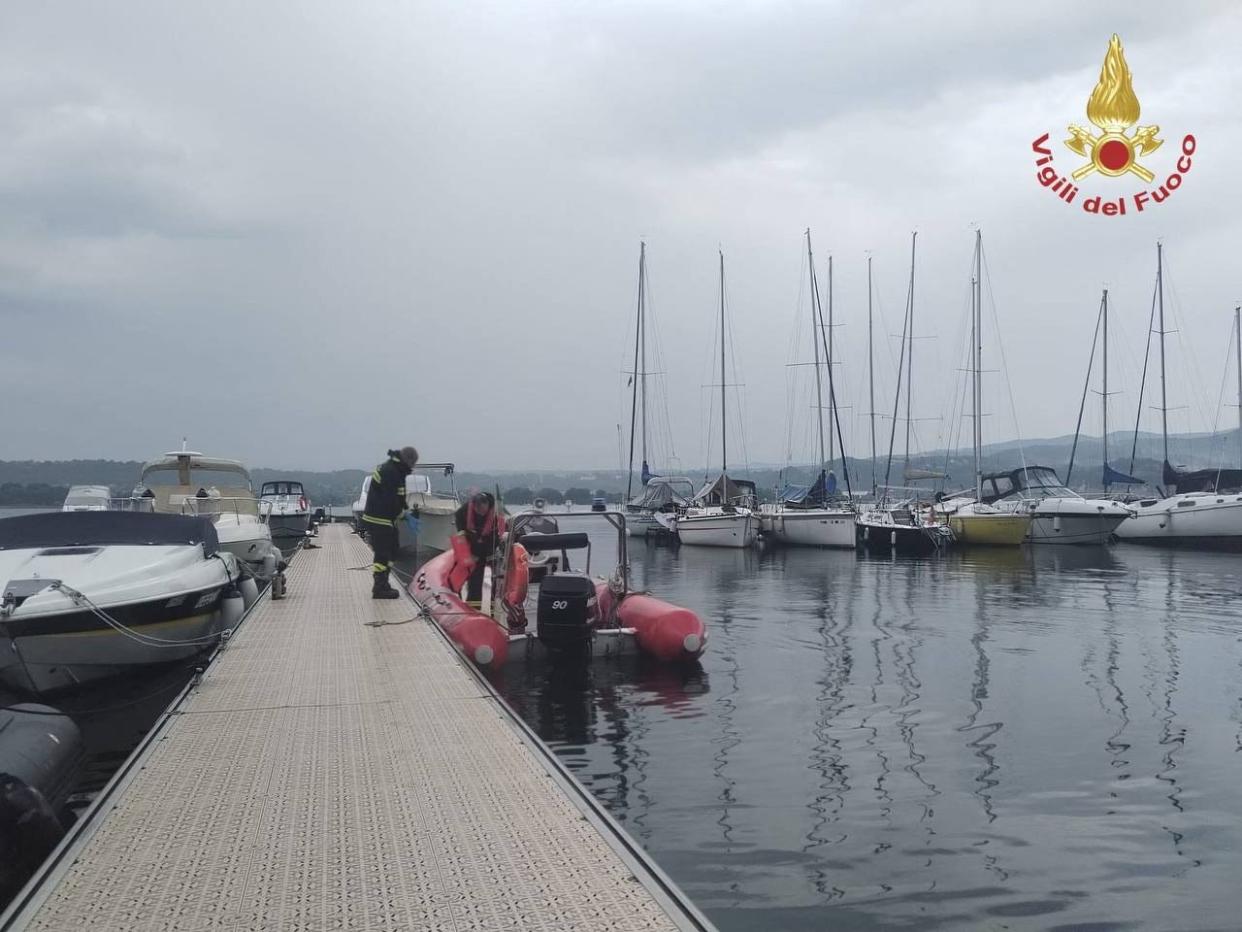 Firefighters search for survivors after a tourist boat capsized in Lake Maggiore, in northern Italy, May 29, 2023.