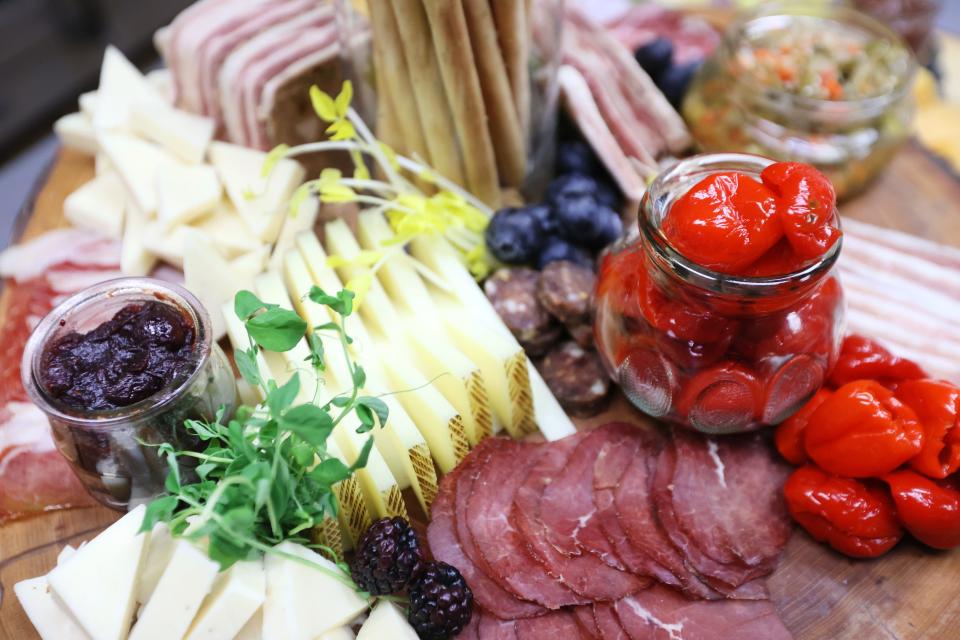 A Paradox Charcuterie board featuring house made jams, pickles, duck prosciutto and pate noisette, amongst a full spread created and cured by Chef Jimmy Gentry and Charcutier Mitchell Marable at their shop on Thursday, January 13, 2022. 