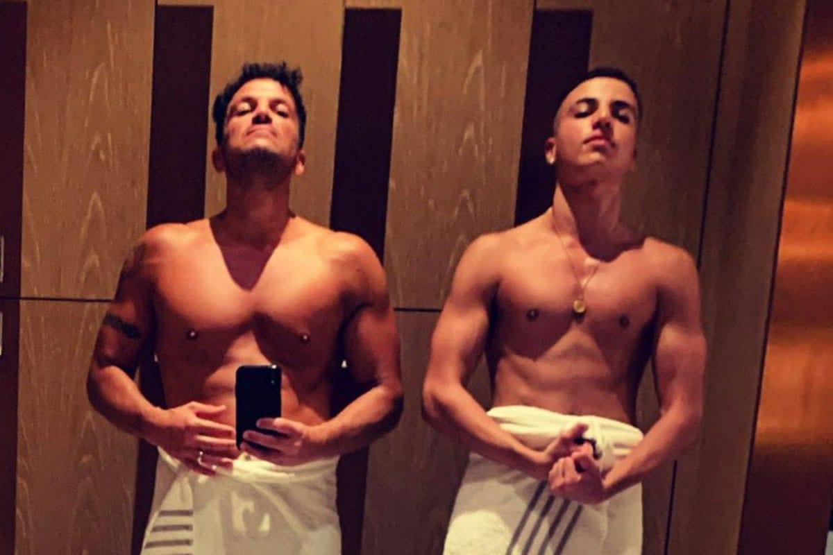 Peter Ande and son Junior pose with their tops off  (Instagram)