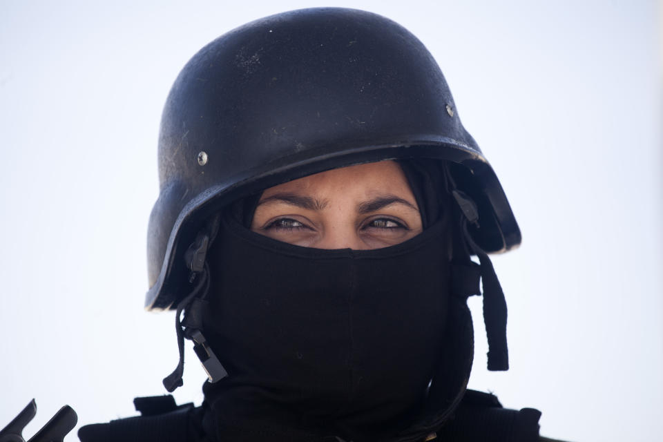 In this Sunday, April 6, 2014 photo, a Palestinian woman who will become a part of the elite Presidential Guard stands during a training, in Jericho, West Bank. Twenty-five Palestinian women are set to become the first female members of the Presidential Guards, a Palestinian elite force of 2,600 men. (AP Photo/Dusan Vranic)