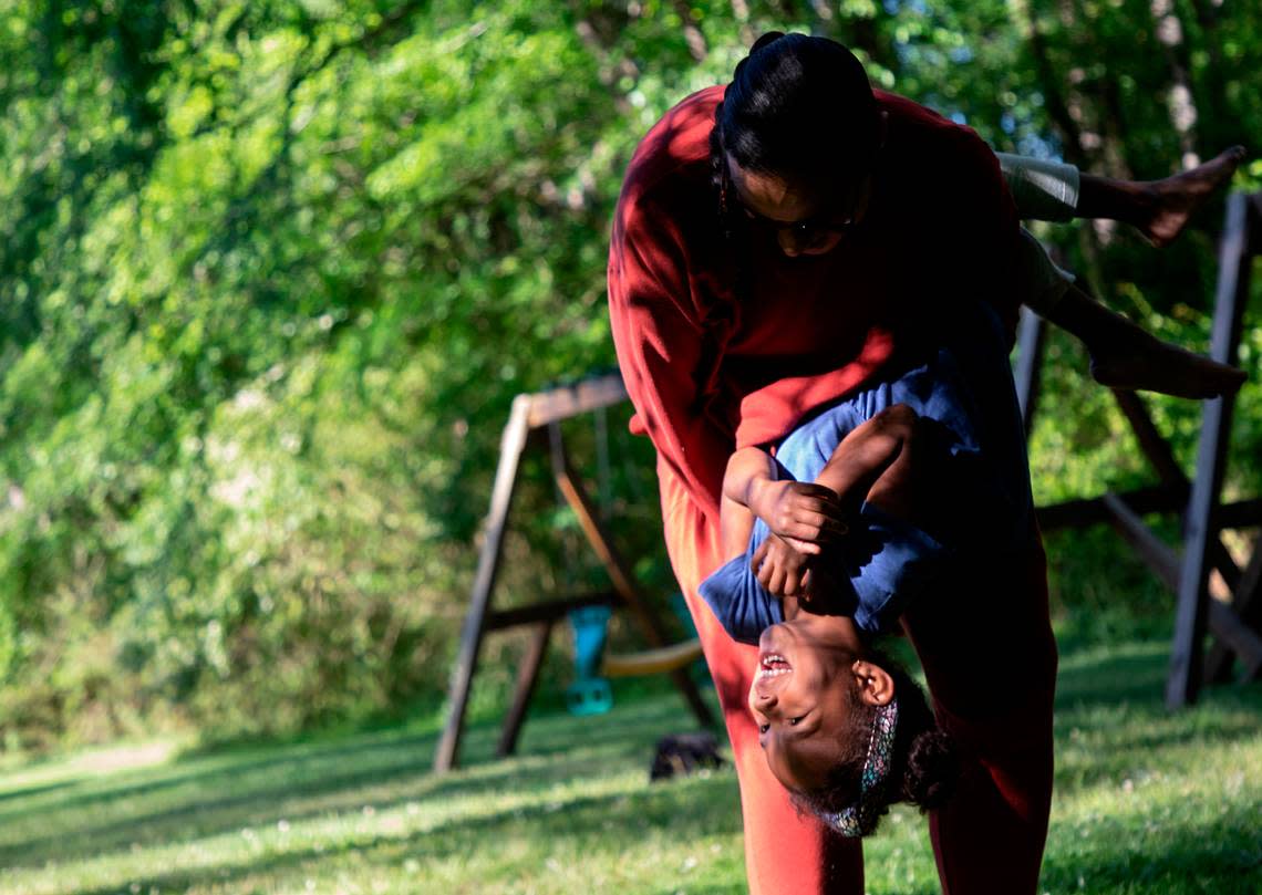 Mavis Daye, 5, laughs as she plays with her mother, Kat Tedford, at a neighborhood park on Monday, May 9, 2022, in Durham, N.C. Tedford and her husband were sued by the Montessori School of Durham over lost tuition payments after they opted not to send their daughter to the school for the 2020-2021 school year due to the COVID-19 pandemic.