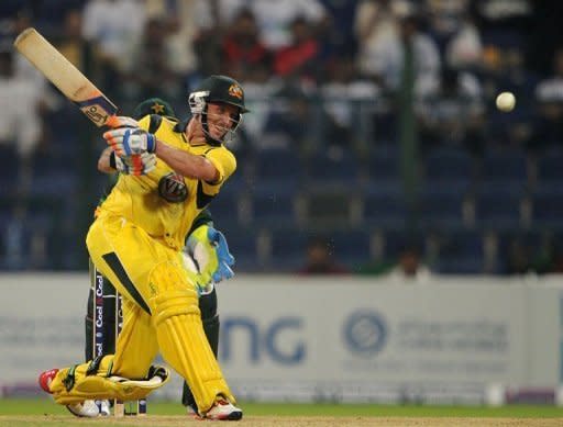 Australian batsman Michael Hussey plays a shot during the second One Day International cricket match between Pakistan and Australia at the Abu Dhabi cricket stadium. Pakistan held a seven-wicket win over Australia in the second one-day, levelling the three-match series at 1-1 on Friday