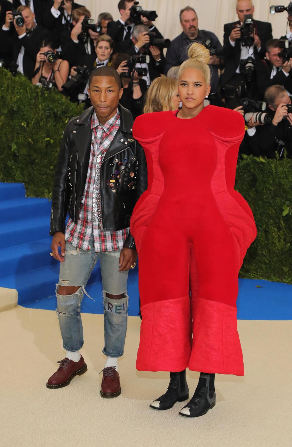 The singer's wife certainly went avant-garde on the night in this oversized red jumpsuit.