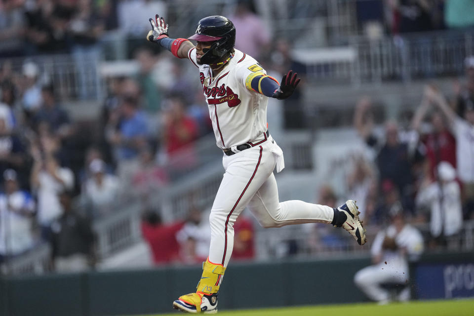 Atlanta Braves' Ronald Acuna Jr. celebrates as he runs the bases after hitting a home run in the first inning of a baseball game against the Philadelphia Phillies Tuesday, Sept. 19, 2023. (AP Photo/John Bazemore)